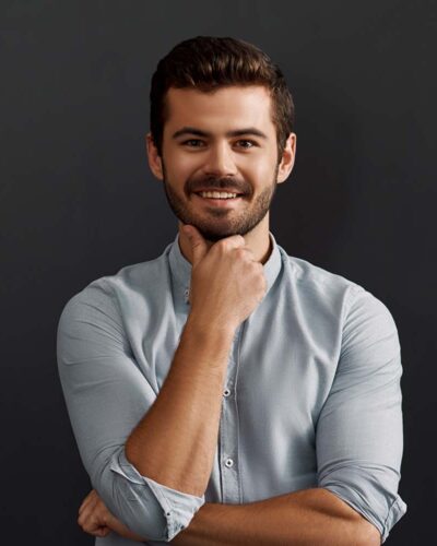 happy-to-work-here-cheerful-young-bearded-man-loo-CT2WE4F-1.jpg