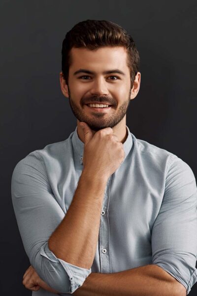 happy-to-work-here-cheerful-young-bearded-man-loo-CT2WE4F-1.jpg