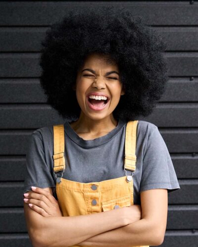 portrait-of-young-laughing-black-woman-isolated-on-XGATQ8D.jpg